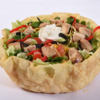 Chicken Taco Salad · Lettuce blend, grilled chicken, cheddar cheese, black olives, green onions, and tomatoes ser...