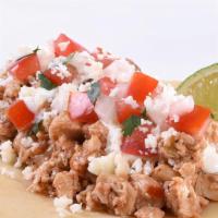 Chicken Street Taco Lime Crema · Marinated Chicken with fresh pico de gallo, homemade lime crema sauce and Cotija cheese crum...