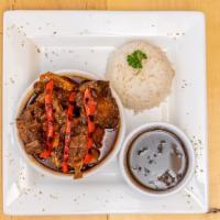 Oxtail Stew · This delicious stew is made with oxtail braised in rich tomato and red wine sauce.