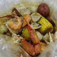 Signature Bombe · 1/2 lb shrimp (no head), 1/2 lb clams, 1/2 lb blue crab, 2 boiled egg, 2 corn, and 2 potato.