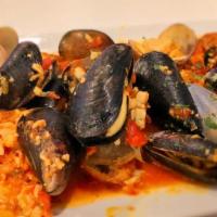 Vongole O Cozze Stregate · Fresh clams, mussels or both sautéed in garlic, olive oil and white wine (white or red sauce).