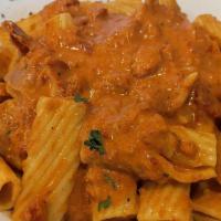 Mostaccioli Al Forno · Penne pasta mixed with ricotta, Romano and parmigiano cheeses, topped with meat or marinara ...
