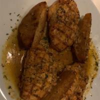 Chicken Vesuvio · Half chicken or boneless breast sautéed in garlic, olive oil and white wine, served with ves...