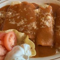 Enchiladas Supreme · Supreme combination of four enchiladas, one chicken, one beef, one cheese, and one bean, cov...