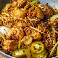 Malaysia/Singapore Rice Noodles · Spicy. Rice noodles stir-fried with meat, eggs, onion, carrot, and bean sprout flavored in s...