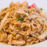 Fried Rice · White rice fried with egg, garlic, onions, tomatoes, and seasoning sauces.