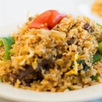 Drunken Fried Rice · White rice fried with garlic, basil, bell peppers, onions, egg, and seasoning sauces.