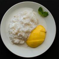 Mango & Sticky Rice · Fresh mango laid on sweet sticky rice bathed in coconut milk.
