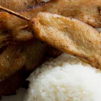 Chicken Satay & Rice · Savory chicken kabobs with a side of white rice.