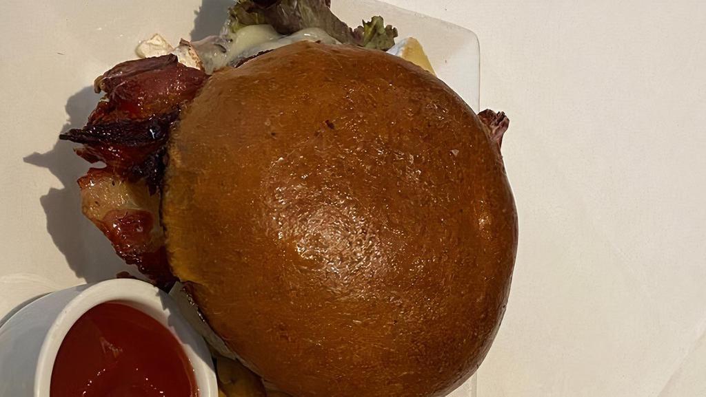 Prhyme Diner Burger · USDA Prime ground beef, pork belly, arugula & onions, cheddar, caramelized onions, fried egg. Served w/house-cut frites