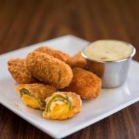 5Pc Jalapeno Popper · 5 JALEPENO CHEDDAR CHEESE POPPERS SERVED WITH RANCH DIPPING SAUCE