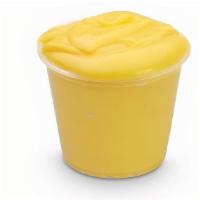 Cup Of Cheese · SIDE OF OUR CHEDDAR CHEESE SAUCE. PERFECT FOR DIPPING AND TOPPING