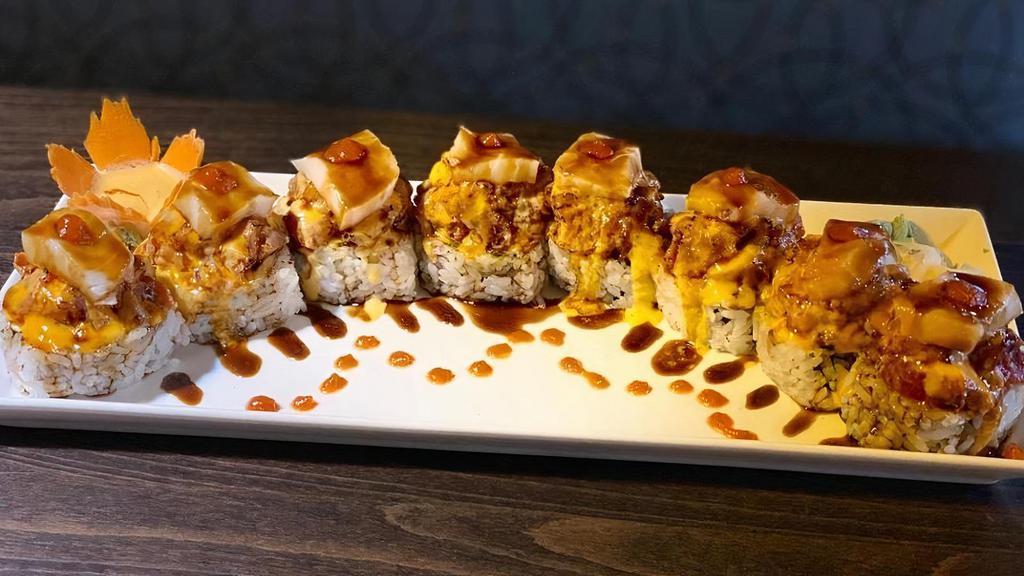 Fuji Mountain · Soft shell crab tempura, cream cheese, avocado topped with torched spicy tuna, spicy mayo and white tuna