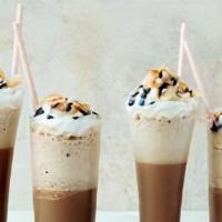 Mocha Coconut Frappe · Iced beverage blended to produce a tasty, foamy, and refreshing drink. Served cold, with whi...