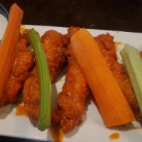 Boneless Wings · Tender white chicken breast hand breaded, tossed in your favorite flavor served with celery,...