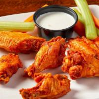 Jumbo Chicken Wings · Fresh, never frozen jumbo wings tossed in your choice of sauces and served with celery, carr...