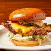 Buttermilk Fried Chicken Sandwich · American cheese melted over a buttermilk battered tender chicken breast fried crispy, topped...