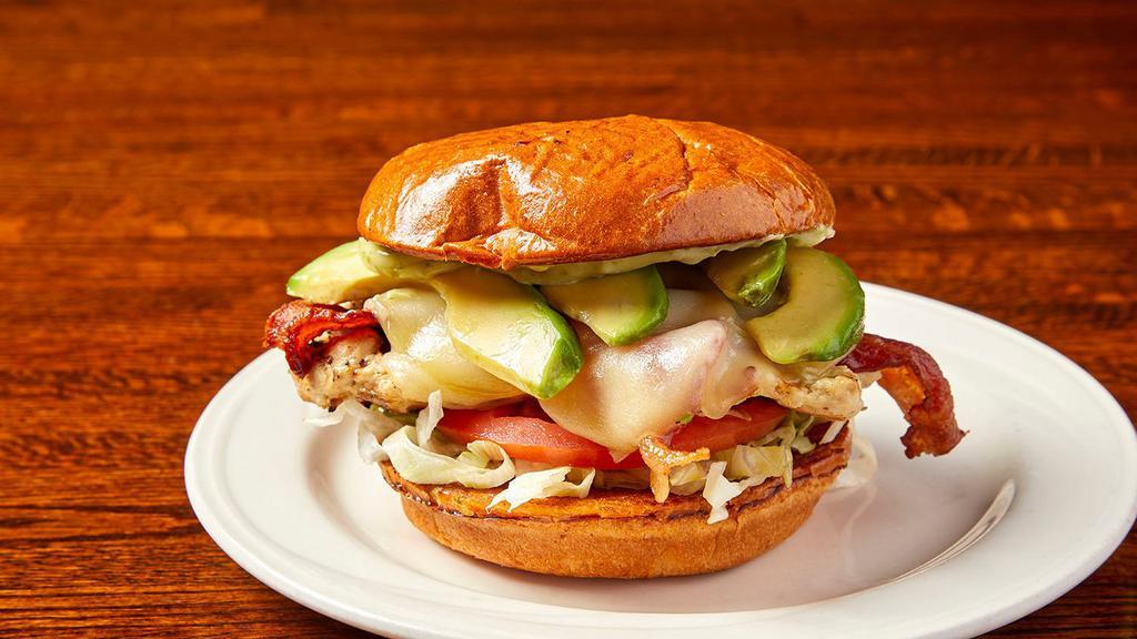 Jessica'S Chicken & Avocado Sandwich · Tender chicken breast with sliced avocado, bacon, tomato, lettuce, herb mayo, and provolone cheese on a brioche bun.