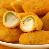 Jalapeño Poppers (6 Pcs) · Golden fried jalapeños and cheese that's just begging to be dipped in ranch