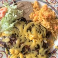 Enchiladas Mole Dinner · 3 ENCHILADAS topped with mole sauce & yellow cheese. Served with Spanish rice & refried bean...