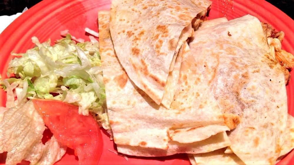 Chicken & Cheese Quesadilla · Quesadilla filled with cheese and grilled chicken in salsa ranchera.  Lettuce and tomato on the side.