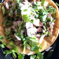 Steak Taco · 1 steak taco, choice or tortilla and toppings