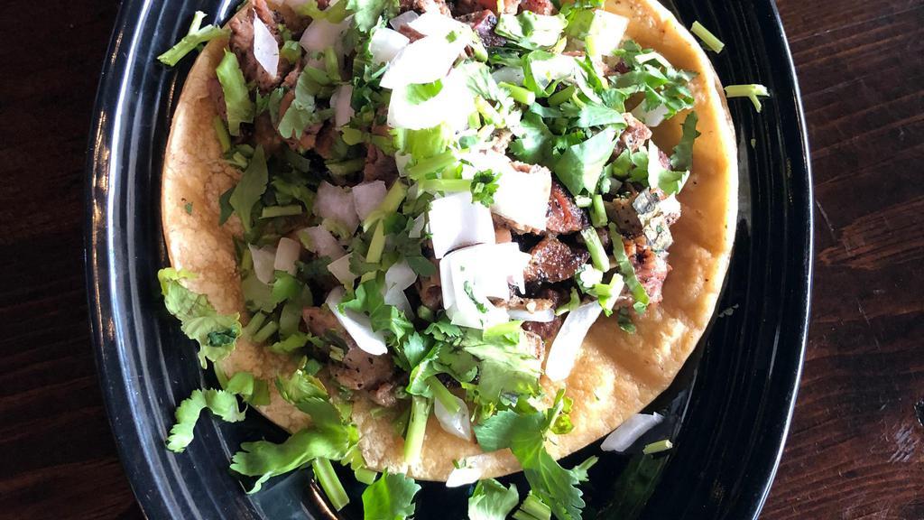 Steak Taco · 1 steak taco, choice or tortilla and toppings