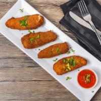 Jalapeño Poppers · Breaded, fried, stuffed with Cheddar cheese and served with marinara.