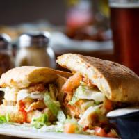 Buffalo Chick Town · Grilled chicken with our savory Buffalo sauce, mozzarella, Parmesan, lettuce and tomato, ser...