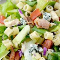 Chopped Salad · Crisp lettuce topped with ditialini pasta, chicken, bacon, blue cheese & diced tomato tossed...