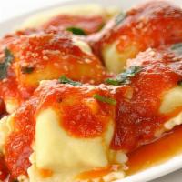 Ravioli · Meat or cheese ravioli filled and topped with marinara.