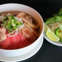 Pho Vn Special · Combination Beef Noodle Soup with Steak, Meatball, Brisket, Flank & Tendon. Topped with onio...