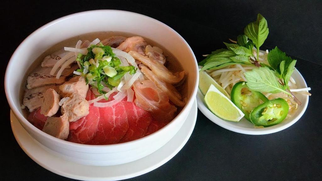 Pho Vn Special · Combination Beef Noodle Soup with Steak, Meatball, Brisket, Flank & Tendon. Topped with onions, green onions and cilantro.