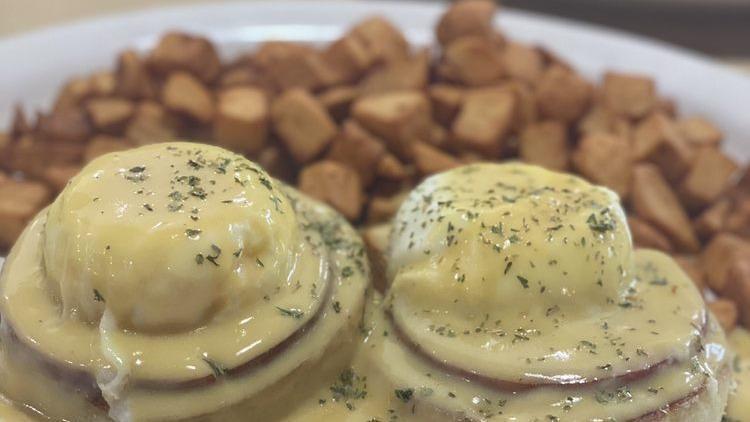 Traditional Eggs Benedict · Canadian bacon, poached eggs and hollandaise sauce.