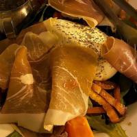 Prosciutto · Arugula salad with Prosciutto di Parma, mushrooms, olives, chick peas & pesto dressing toppe...
