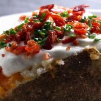 Loaded Baked Potato · A large Idaho Potato loaded with Bacon, Sour Cream, Chives. and your choice of cheese.