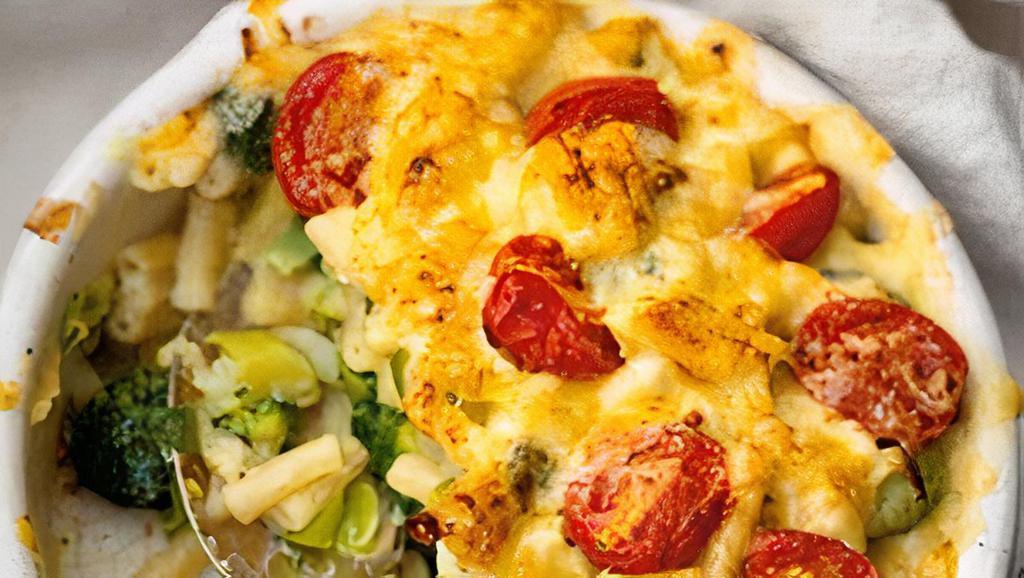 Veggie Mac · Vegetarian. Cavatappi noodles, rich & creamy cheese sauce, sweet peas, asparagus, cherry tomatoes baked with ritz cracker & cheddar crust.