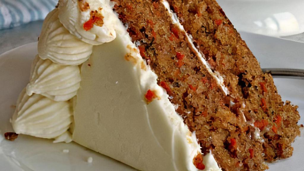 Amazing Grace'S Carrot Cake · Grandma Grace Brady's family recipe is one for the ages! Served warm & gooey, with pineapple, toasted coconut, pecans, spices and cream cheese frosting. For every carrot cake we sell, we will donate a meal to new beginnings on your behalf to feed one of our furry friends in need. Making the world a better place...one piece at a time!