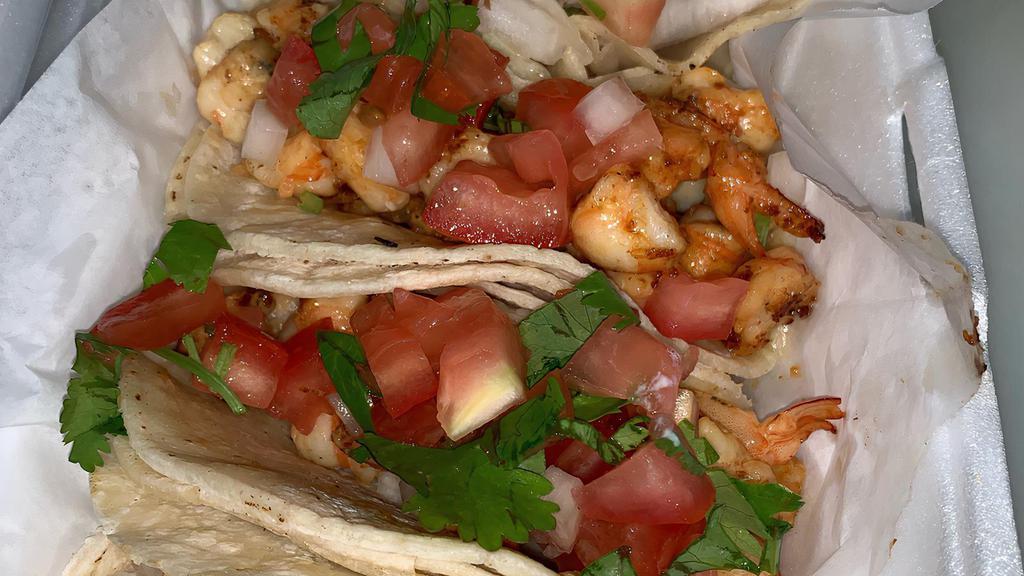 3 Shrimp Tacos · Served with rice and beans.