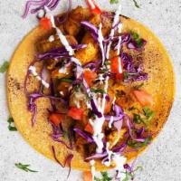 Chicken Shawarma Taco · Delicious chicken shawarma with shredded cabbage, diced tomatoes, cilantro, and tzatziki or ...