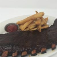 The Barn’S Bbq St. Louis Style Pork Ribs
 · Slow cooked in our smokehouse with house rub, bourbon BBQ sauce, and steak fries.