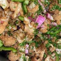 Cauliflower Salad · Lightly fried cauliflower with green olives, green pepper, and red onion.