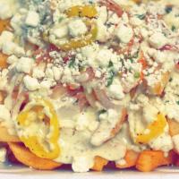 Feta Fries · Order of large fries topped with fresh feta cheese, grilled banana peppers and onions, and o...