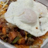 Supreme Skillet · Golden hash brown, ham, sausage, bacon, grilled onions, tomatoes, bell peppers, mushrooms, C...