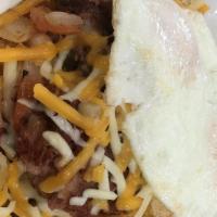 Corned Beef Hash Skillet · Golden hash brown, corned beef hash meat, onions, tomatoes, bell peppers, mushrooms, Cheddar...