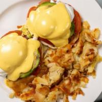 California Benedict · Two poached eggs with avocado, slice of tomato, canadian bacon and hollandaise sauce on engl...