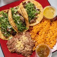 Steak Taco Dinner · Three tacos served on corn or flour tortilla rice and beans on side
