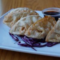 Pot Stickers · Five pieces. Ground chicken and cabbage with garlic soya sauce.