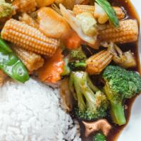 Pad Pak · Broccoli, baby corn, peapod, carrot, cabbage, water chestnut, brown sauce. Served with a sco...