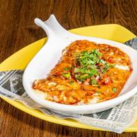 Queso Fundido · Appetizers melted cheese and spicy chorizo. Served with flour tortillas.
